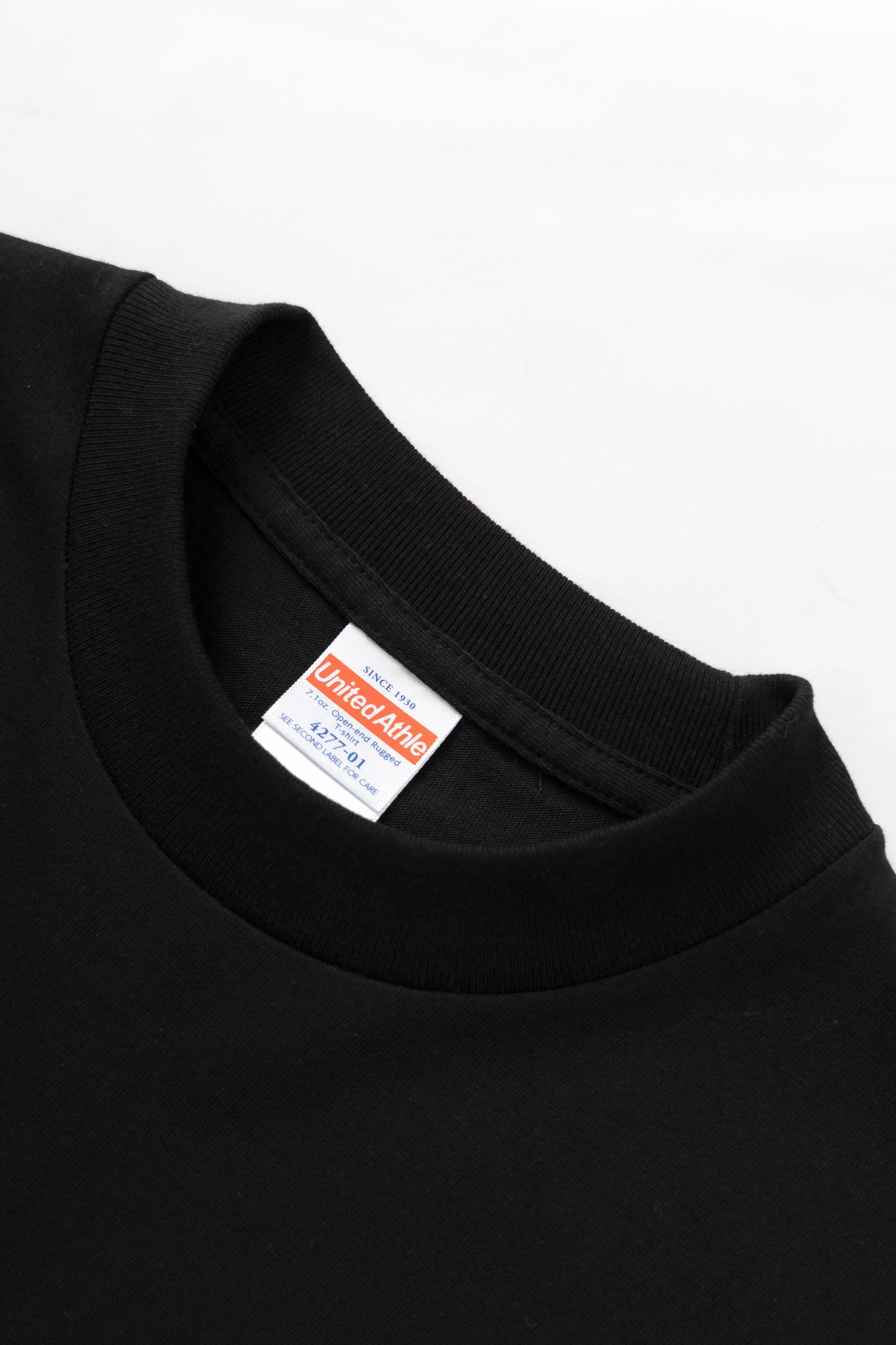 United Athle - 4277 7oz Open End Rugged T-Shirt - Black Raw Hem Finish Flattering Design